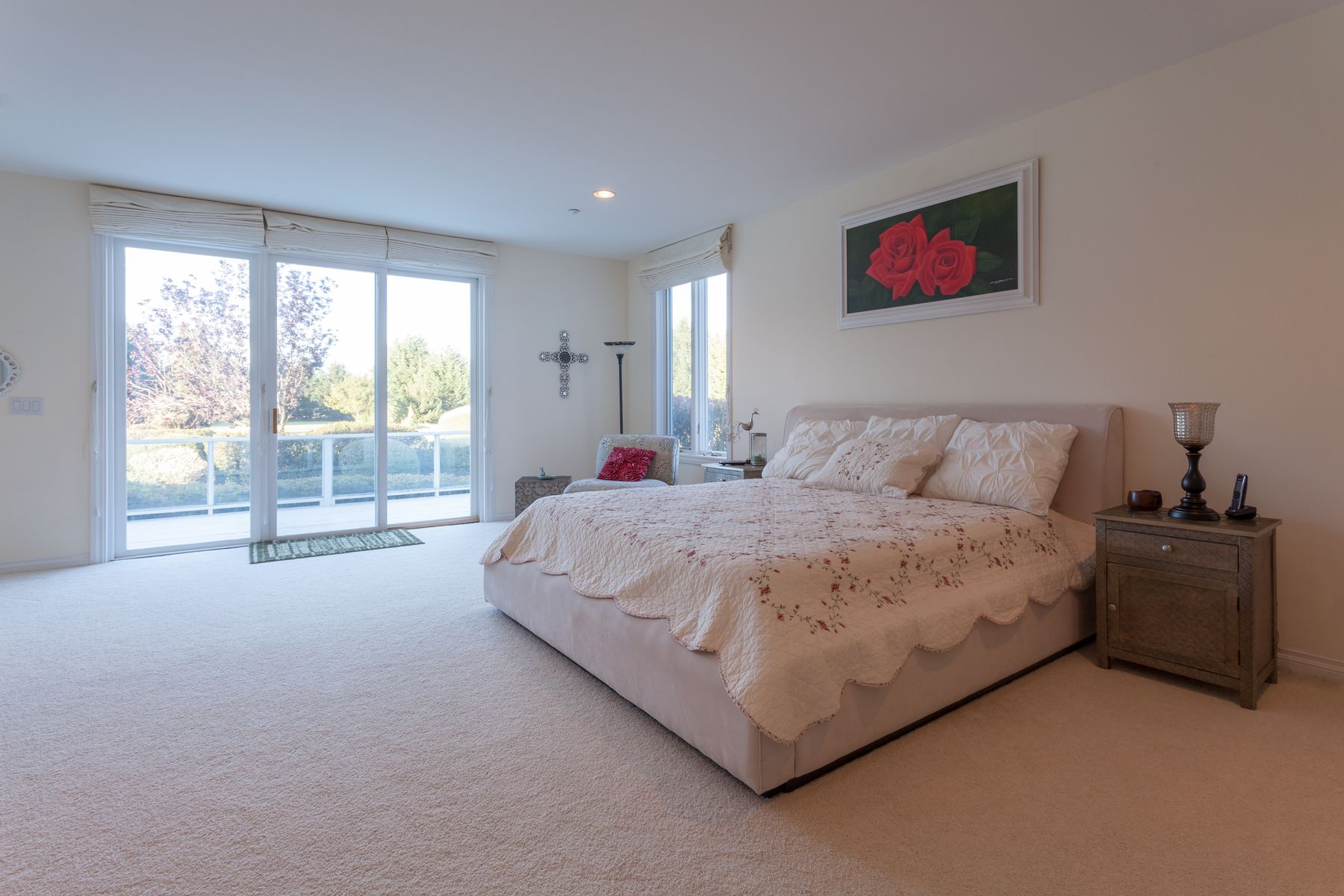 Primary bedroom with doors to the balcony