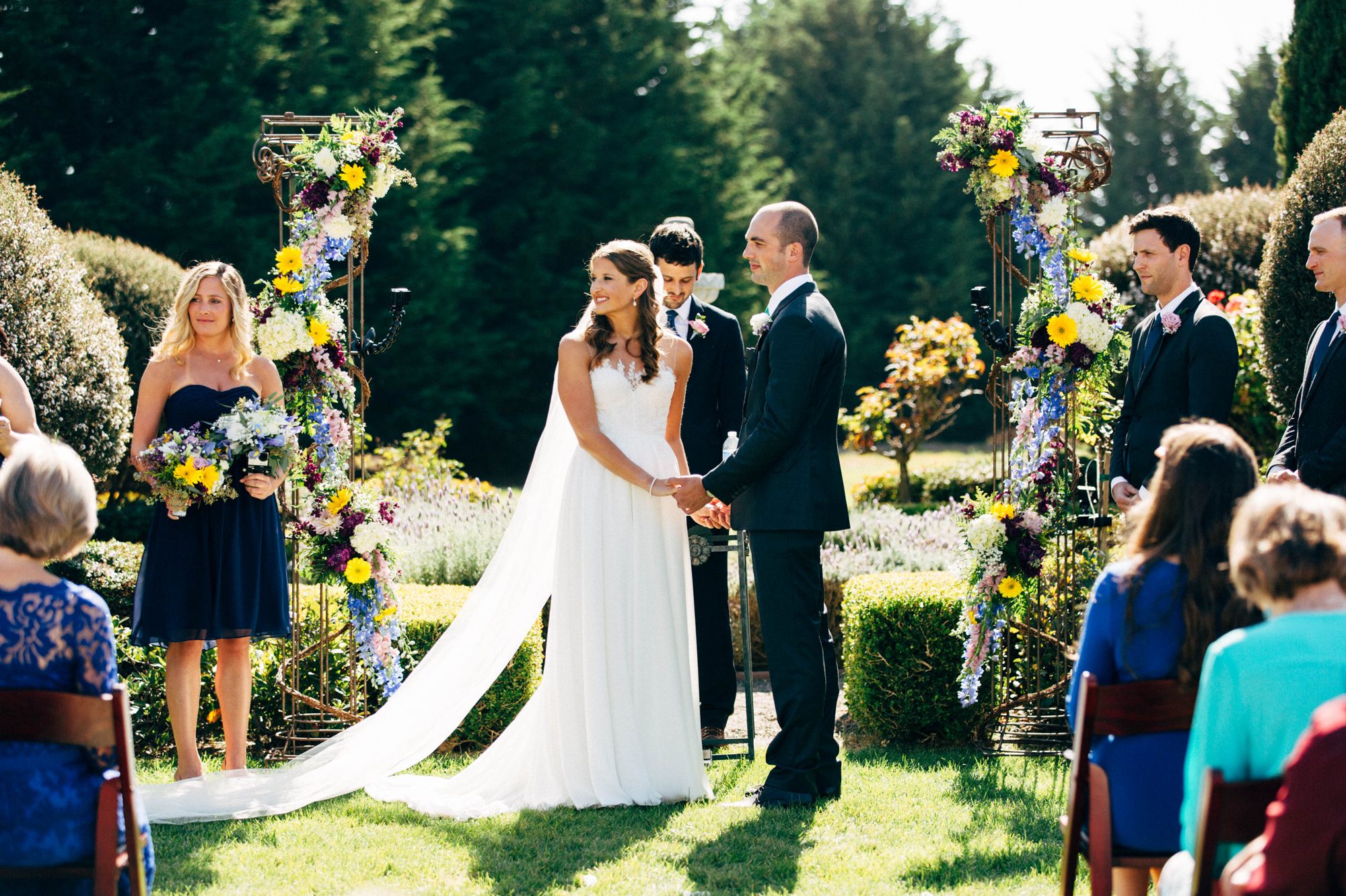 A wedding ceremony under the trees at The Heritage Estates